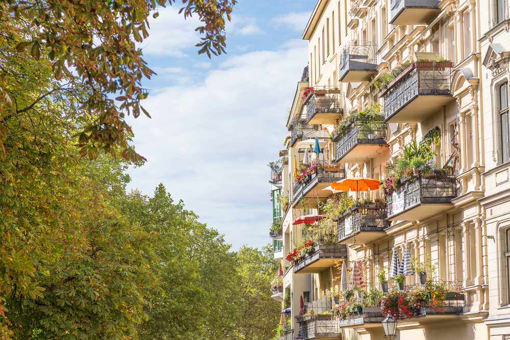 Beautiful balcony patios along a marble building.