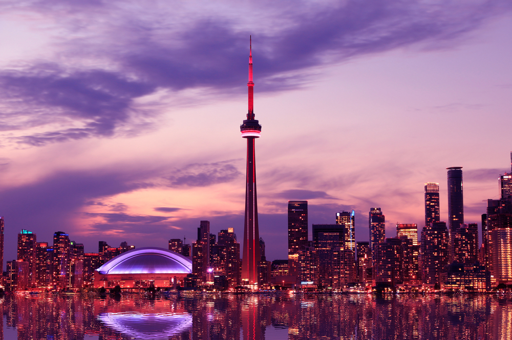 The Toronto skyline lit-up at sunset.