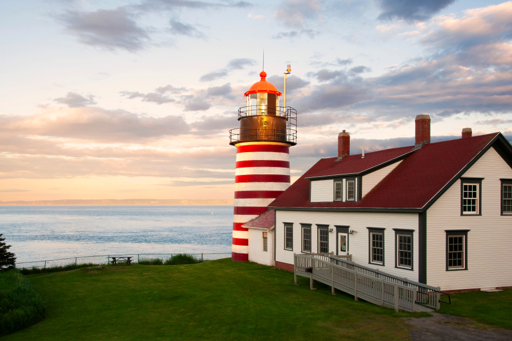 Sunset on the West Quoddy Head lighthouse, with its red and white stripes, referred to as the “candy cane” lighthouse in Downeast Maine, located in the easternmost point in USA.