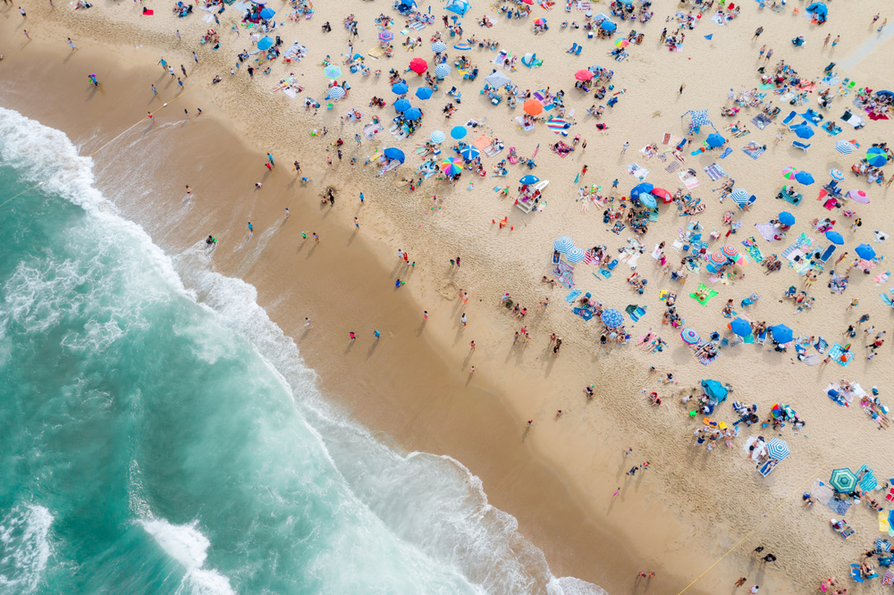 An aerial view of one of the popular beaches at Asbury Park full of people.