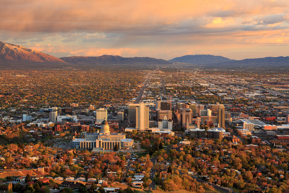 Bird's eye view of downtown Salt Lake City during a late fall afternoon with the Wasatch Mountains in view.