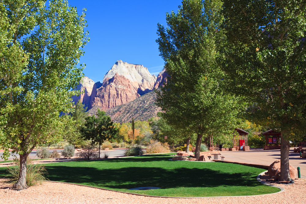 View of the Zion Canyon peaks from a shady park in Springdale, Utah.