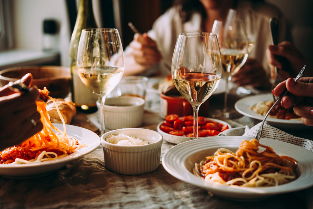 Friends enjoying an Italian dinner at a restaurant.