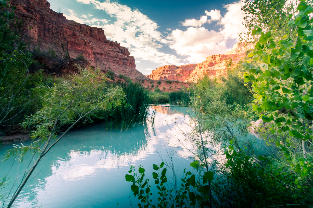 Clouds reflected in the aquamarine water of Havasupai Falls, Arizona.