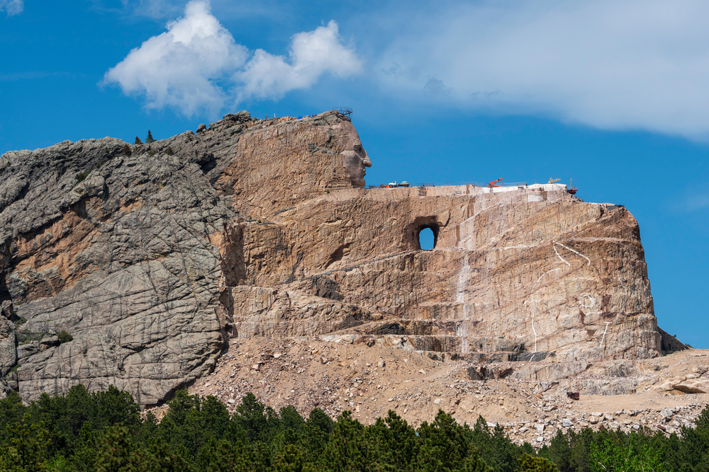 The face of the famous Native American Chief Crazy Horse begins to emerge from an ongoing construction project at a stone mountain in South Dakota.