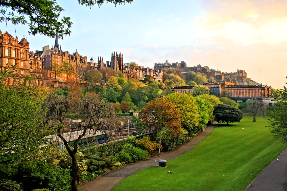 View of old Edinburgh, Scotland, at sunset from Princes Street Gardens.