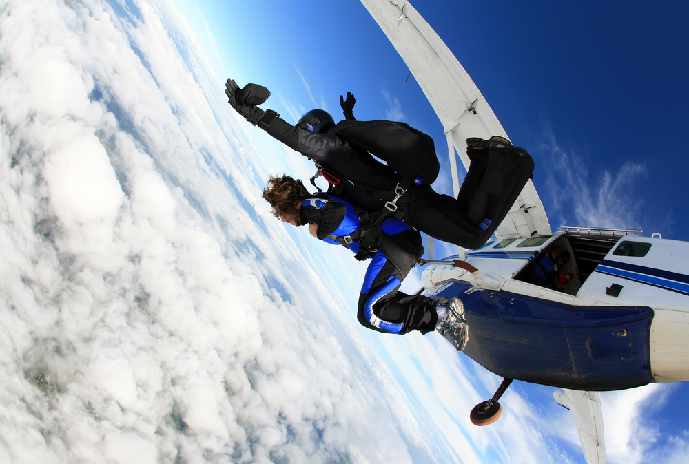 Skydiving tandem jumping from the plane.