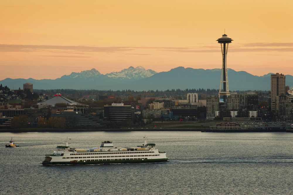 Seattle space needle and ferry at sunset