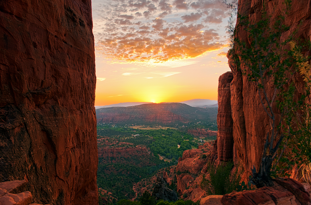 Sunset between two red rock formations in Sedona, Arizona.