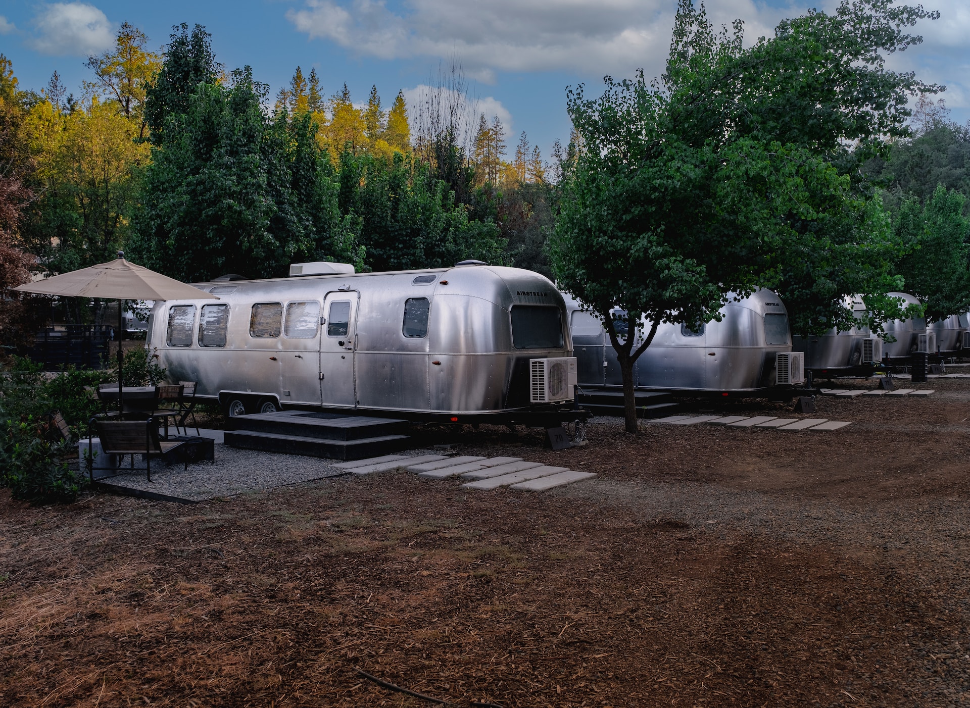 Multiple Airstream trailers parked in Yosemite.