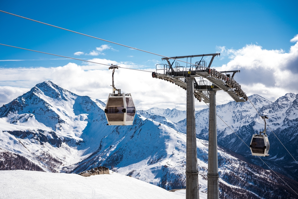 Cable car running up the side of a mountain in the Italian alps.