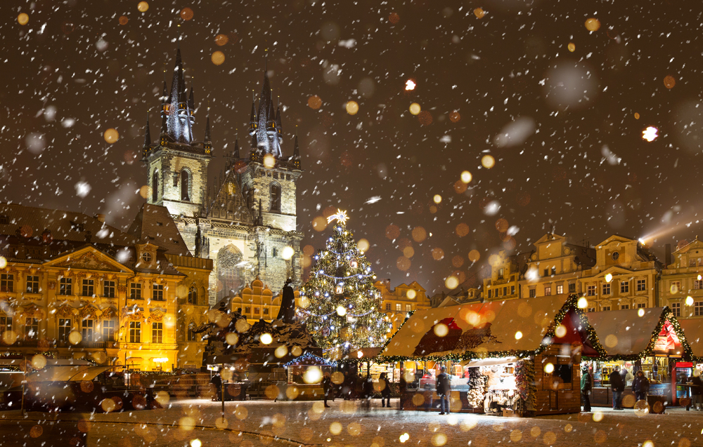 The Old Town Square of Prague during a snowstorm around Christmas.