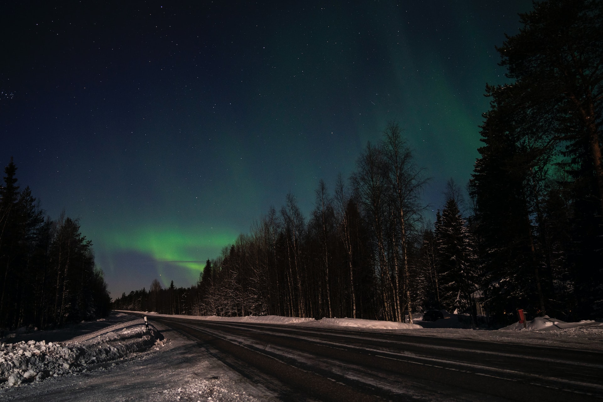 The northern lights, or a natural spectacle of green in the middle of the night sky.