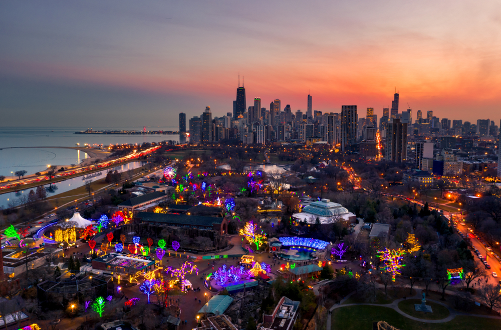 Chicago at dawn from the sky with Christmas lights visible below.