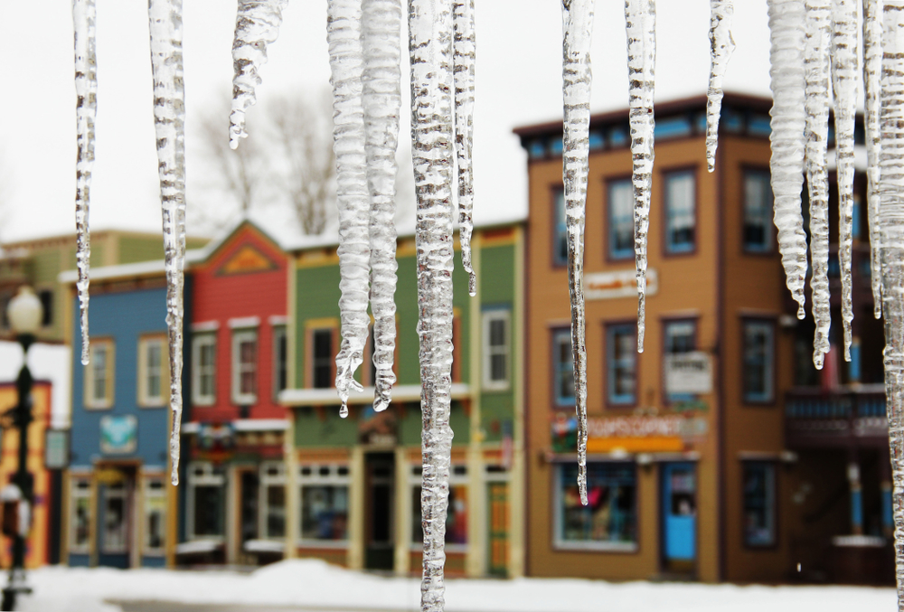Icicles hanging in front of Crested Butte, Colorado, a small colorful ski town.