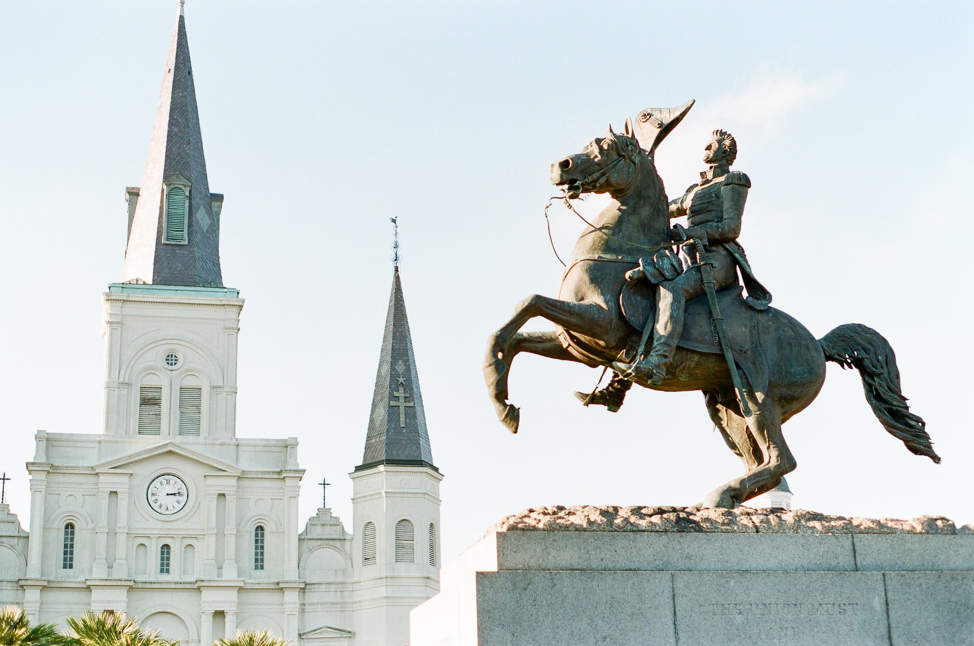 Statue of horse and rider and castle-like building in Jackson Sqaure.