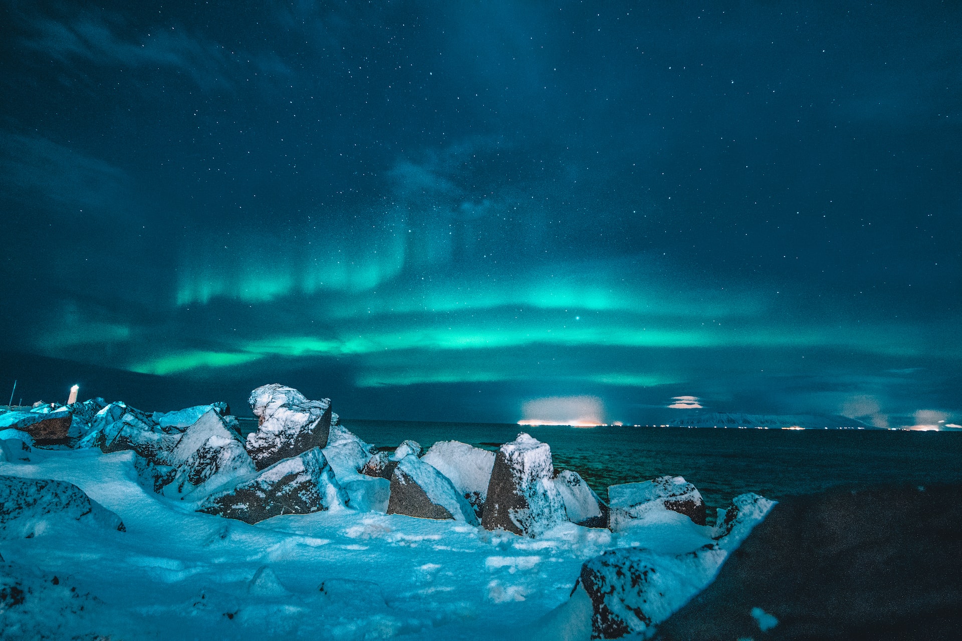 The northern lights over a wintry scene in Iceland.